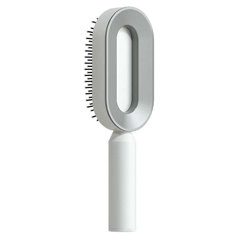 Women's self-cleaning hair brush