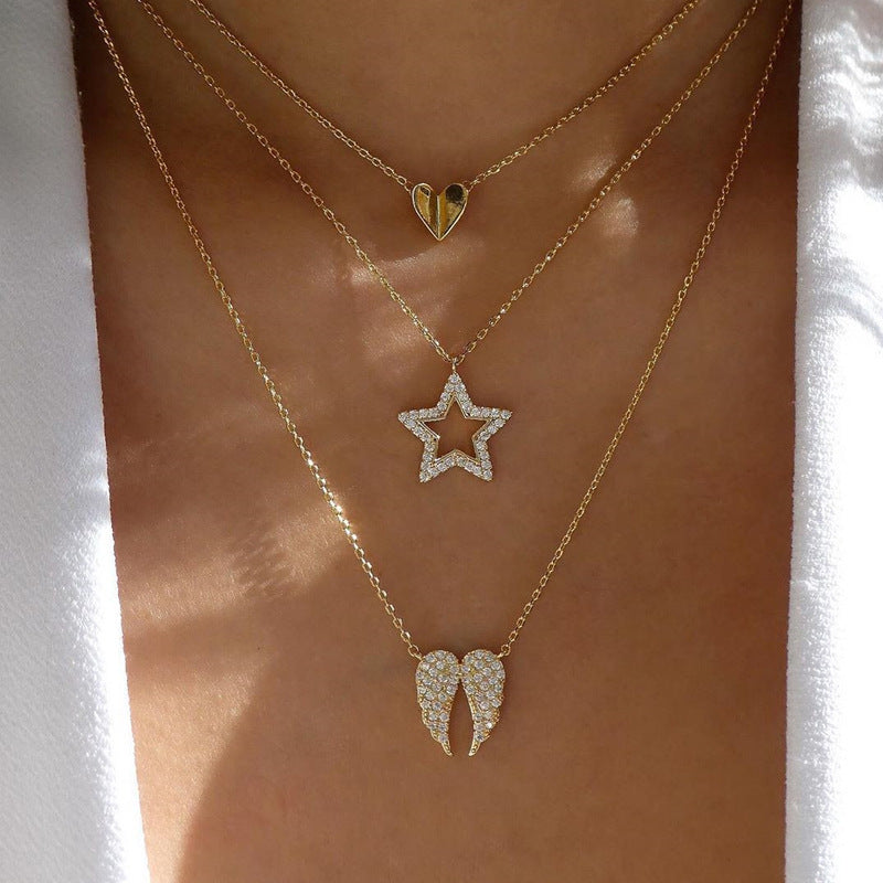 Crafted with multilayer gold-plated chains and detailed with pearl butterflies and a sun star pendant, this necklace makes a charming and timeless gift.