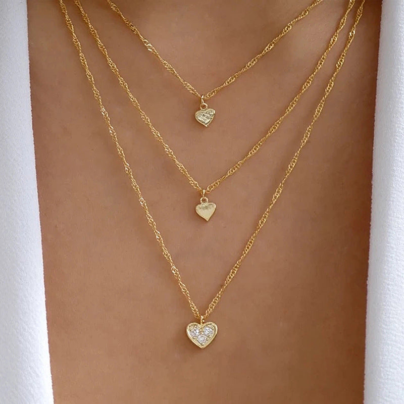 Crafted with multilayer gold-plated chains and detailed with pearl butterflies and a sun star pendant, this necklace makes a charming and timeless gift.