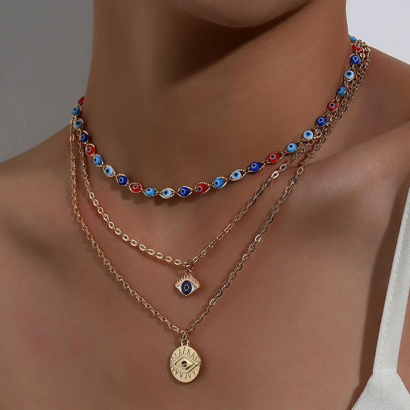 Crafted with multilayer gold-plated chains and detailed with pearl butterflies and a sun star pendant, this necklace makes a charming and timeless gift.