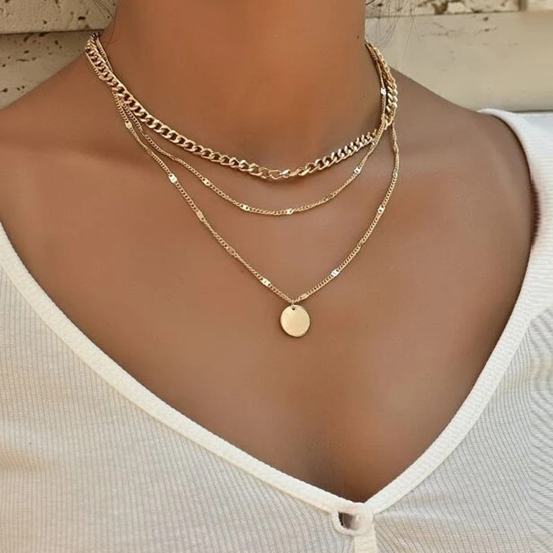 Crafted with multilayer gold-plated chains and detailed with pearl butterflies and a sun star pendant, this necklace makes a charming and timeless gift.